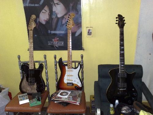 Guitars! - My husband's guitars. My husband loves to play with his guitar. If we have more money. I bet he would love to buy guitars for hos collection. It means we'll also have bigger house for us to keep it :)