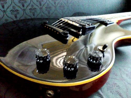 up close guitar - on couch guitar for a new side shot.