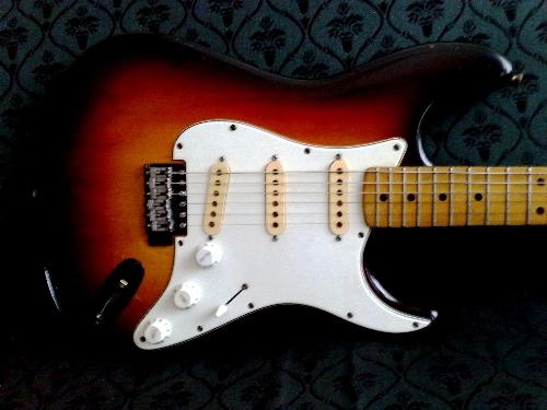 The right close up - What can you say about this photo? This is my husband's favorite guitar.