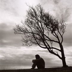 Social anxiety - Lonely guy under a tree.