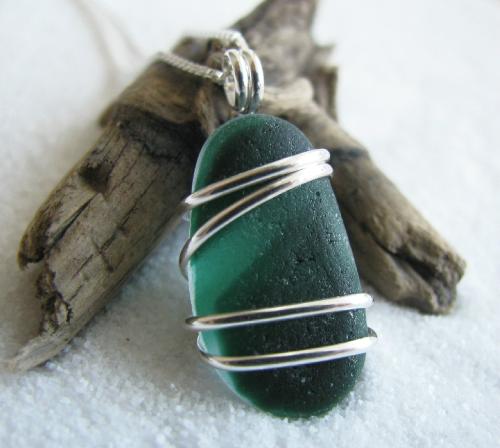 Evergreen- Multi-Green Sea Glass Necklace - A beautiful example of English 'end of day' multi green sea glass, measuring a bit over 3/4' in length, is wrapped in sterling silver wire and hangs on an 18' sterling silver Venetian box-style chain. Very pretty and sure to garner second-glances and compliments!