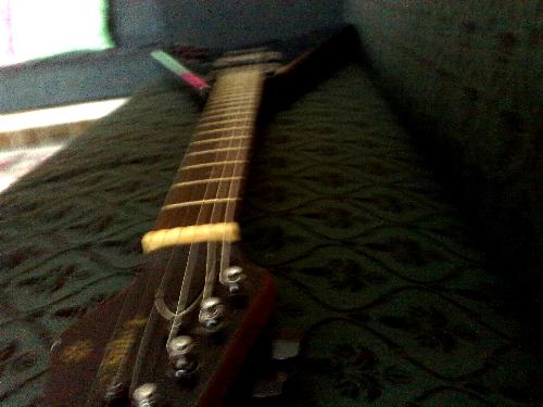 Black Guitar - V shape guitar.