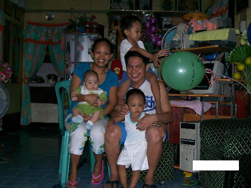 my family.... - this picture shows a happy family. each faces shows a smile, happiness that comes from the heart. my the kids, all boys, add meaning to the family we have. i'm so glad to ave my family.