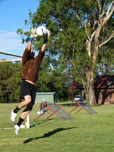 caught! - this photo is taken just as josh is taking a ball up high and just to his left during a training session. his quick feet prevented him from having to dive