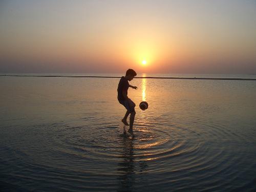 Sunset soccer - It's a wonderful picture of playing soccer in the sunset.