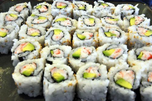 Sushi - Sushi in layer with sushi rice, shrimp and avocado
