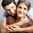 Mother and Son - this is the picture related to older mother and young son smiling and facing the life beautifully