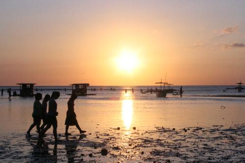 sunset - Just enjoying the beautiful sunset. This was taken during the summer near a beach resort in Batangas, Philippines. It also shows another meaning of sunsets... people going home