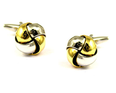 Silver and Gold earrings - A pair of silver and gold stud earrings.