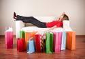 tired of shopping - this photo shows the women who really got tired of shopping and kept her shopped things nearer to her sofa and lying down.