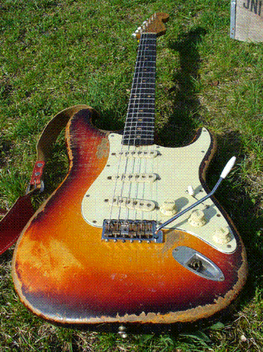Vintage Guitar - I loooove vintage guitars, they look like 'OMG, he had played this guitar for a lifetime!'.  This maybe be the John Frusciante '61 strat, or for sure a alike.
