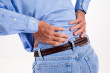 back pain5 - this is the photo of the senior person who is suffering with back pain and is rubbing his lower back muscles.