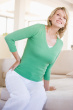 women with back pain at home - this is the photo of the women who is suffering from back pain at home
