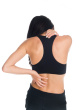 women with neck and back pain - this is the isolated photo shot of a women in a fitness outfit experiencing neck , shoulder and back pain