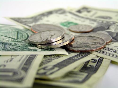 cash and coins - This is a picture viewing the Dollar currency, as coins and as paper money.
