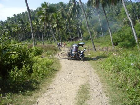 Road Block! - This was taken when I was in Glan, South Cotabato. We were on our way to Kalunasan where a beautiful beach with refreshing waters facing the ocean can be found. On the way there is really very difficult. The road is not cemented and is very narrow. It was raining the day before so there was kind of like a mud road block. The tricycle wasn't able to make it across the road block with us on board so we got out and walked a few meters ahead.