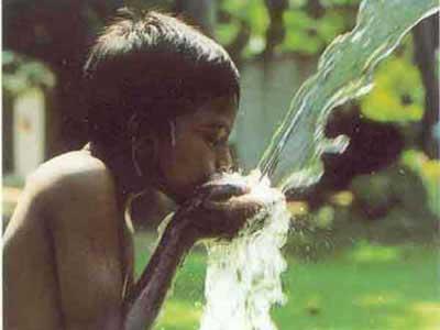 safe drinking water - A boy drinking water