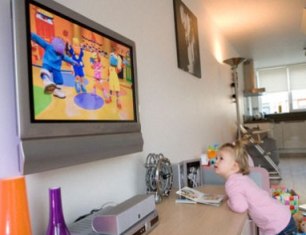 Child Watching Television - A girl watching tv