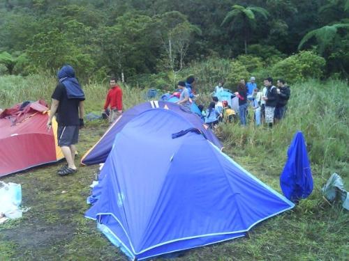 mountain climbing and camping - building tents after climbing a mountain.