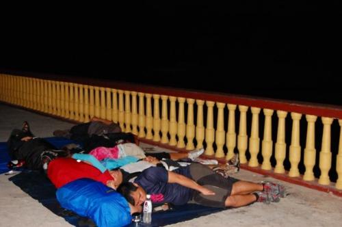 sleeping - sleeping the night on the floor, waiting for an early boat trip