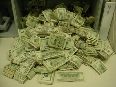 cash - loads loads of pretty nice, bundles up cash on a sort of grouping.