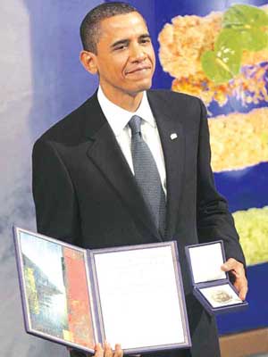 Barack Obama - Barack Obama with the Nobel Peace Prize Medal and citation.