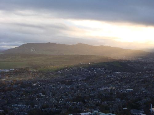 Sunset in Edinburgh, Scotland - I climbed up a hill to get this picture. Well worth it in my opinion. It is one of the most beautiful pictures I have ever taken, with sunlight covering a portion of the city. Simply breathtaking!