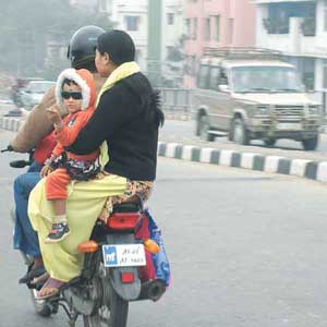 commute  - People commuting with their child in a bike like that, not very safe.