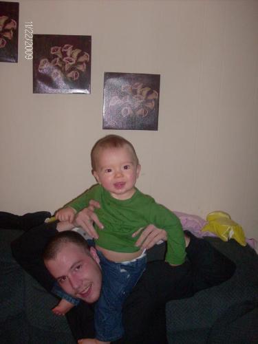 Sitting on daddy's shoulders - This is a picture of me and my son. The funny thing is it looks alot like the picture in my mind of me sitting on my father shoulders, probably my earliest memory is me reaching for the sky while I'm holding onto my fathers forhead. Someimes covering his eye's we would trip and fall ha!