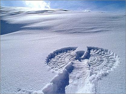 snow angel - A snow angel is a human-made depression formed in an area of snow in the shape of an angel. Making snow angels is a common childhood game.