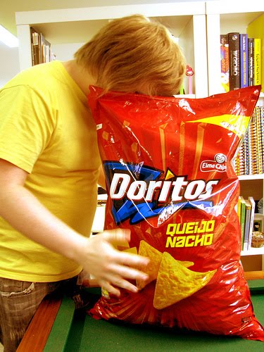 Giant Doritos - A boy getting in on a great doritos. 