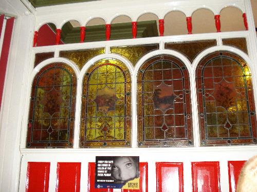 Atmospheric Pub - We were in this pub last night. It is called The Golden Lion and has - usually - Punk Bands on every Saturday. We know one of the singers of a band called No Thrills, he is called Pez. The stained glass in the photo is probably an original feature from the time the pub was built, a rare sight indeed!