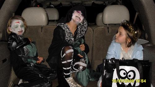 Kids Halloween 09 - Here are the kids and their friend Blair in the back of the Tahoe on Halloween. This was the first year they both wanted to actually dress up as something 'scary'. Even if you want to hang on to the little ones, it might be a good time, like Halloween, to let them run a little wild. You're only young once you know.