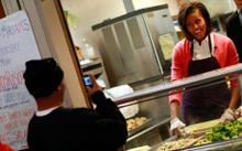 Work - Michelle Obama is seen working - serving the poor