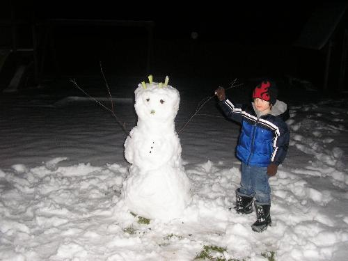 My son and his snow man - The snow man we made last night. 