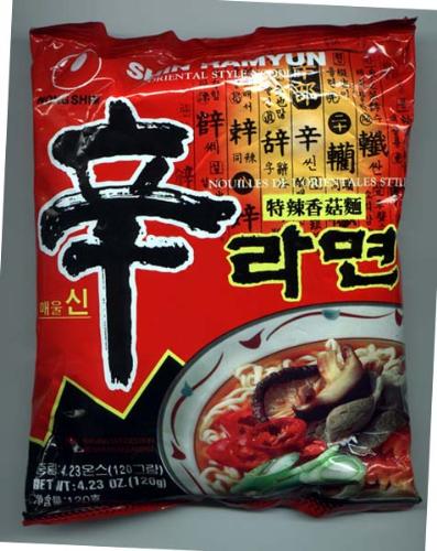 Shin Ramyun (Shin Ramyeon) - Shin Ramyun comes with a seasoning packet and a packet of dried vegetables, and is usually prepared in a pot or other container.  It is also sold as in instant cup or instant bowl form. This version was first produced in Korea in 1981.[2]  Like most instant noodles, it offers only minimal nutritional benefits. During preparation, it is possible to add vegetables, dumplings, eggs or meat to improve the nutritional value of the meal.  There is also a seafood flavor variant of the noodle.  wikipedia.org