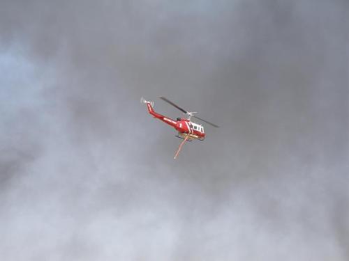 Helicopter - Firefighter helicopter going to get more water.