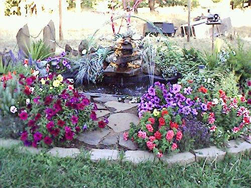 my first koi pond - This is the first koi pond I built. Learned alot sence then. But my fish are thriving.