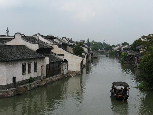 Wuzheng  - River,boat,white wall,black roof .It is a beautiful place worth visit. 