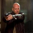 action - Photo shows Bruce Willis holding a gun.