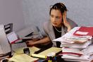 Office job? No, please. - A woman stressed-out with all of her paperworks
