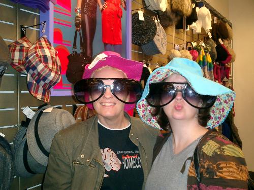 mother daughter silliness - This is me and my daughter shopping at the mall. We were trying on hat after hat and taking picutes and laughing! It was so much fun!