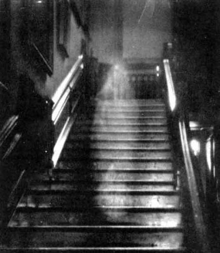ghosts - A picture of a ghost walking down the stairs, all white and stuff. it&#039;s of a lady.