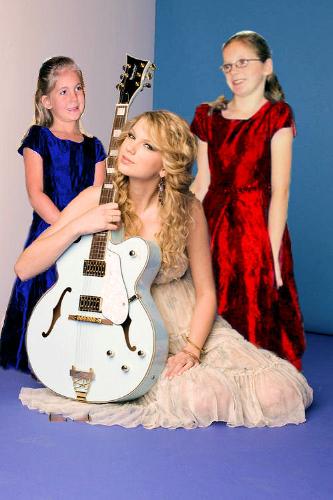 my granddaughters with taylor swift  - they took their pictures and printed them out and went to walmart and made posters to hang in their room