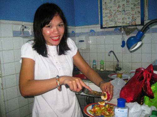Christmas Party on NICU - Slicing some tomatoes and salted egg. Stolen shot. Inside the NICU Department. Celebrating Christmas with the Nurses and Doctors or OR and NICU. I know I'm quite tan in here.