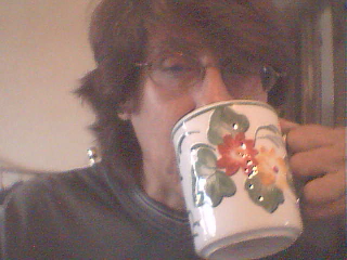 Karen sipping that java - Karen at her computer waking up to a cup of coffee