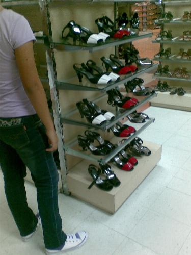 shoes of different colors - shoes of different colors but same style on display at a department store