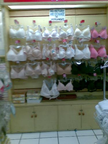 undergarments - bras and panties on display in a women's section of a department store