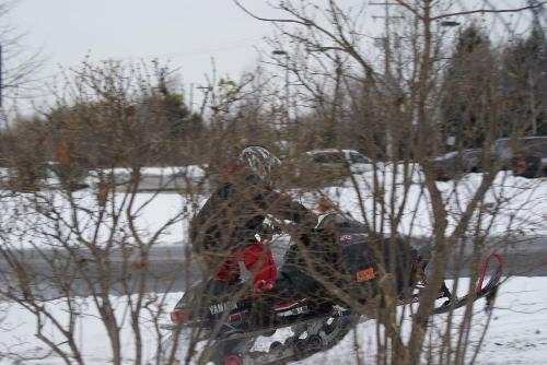 Playing in the snow - Here is a picture of me doing a wheelie on a snowmobile