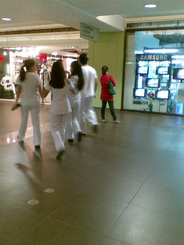 school uniform - students in their school uniform in a mall